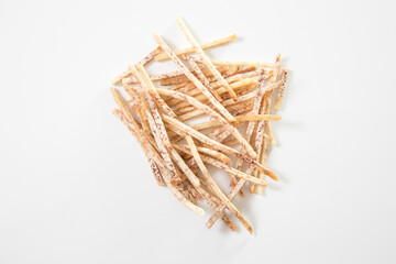 fried taro chips on white background. Thai style homemade healthy sweet snacks.