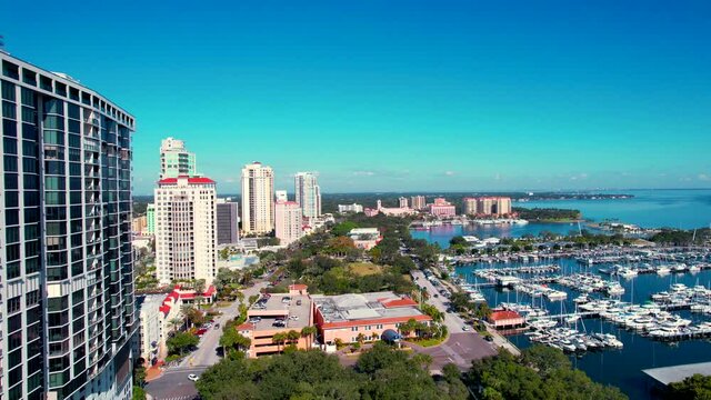 Panorama of city downtown St Petersburg Florida. St Pete FL Pier and park. Cityscape with Skyline or skyscrapers buildings. State Florida. Deep blue sky. Aerial Videography footage