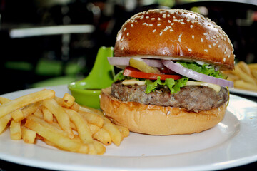 hamburger and fries. Delicious grilled burgers