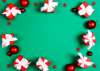 Christmas green frame background with gifts and decoration.