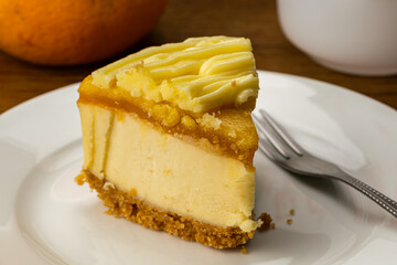 Closeup view of a portion of delicious homemade Lemon Cheesecake.