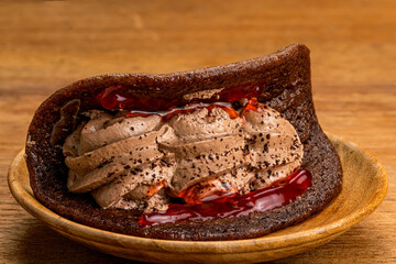 Side view of delicious Mini Black Forest Pancake with fresh cream.