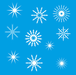 White snowflakes of various shapes on a blue background