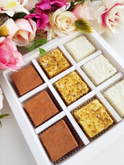 Homemade sweets, Sufi pigeon milk with coconut and nuts in a festive box. Sweets for tea