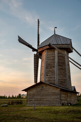 old wooden windmill against the sky