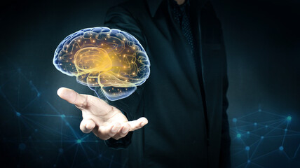 Businessman holding l human brain