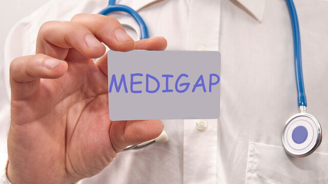 Medigap Written On The Doctor's Card. Medical Concept