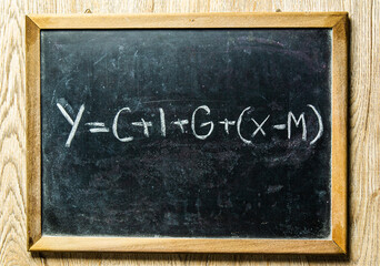 national income  equation on blackboard, in studio Chiangmai Thailand.