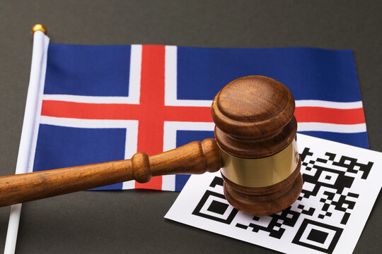 Judge gavel, barcode sheet and Iceland flag, concept of administrative punishment for violation of the regime using QR codes
