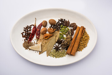 Indian Garam masala powder and colourful spices. selective focus