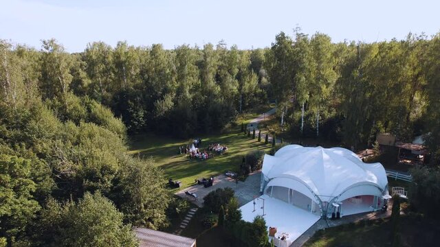 Russia, Nizhny Novgorod region, Kstovsky district, Kadnitsa village, August 14, 2021. Aerial photography from a quadrocopter - wedding ceremony in nature, on-site registration of the wedding