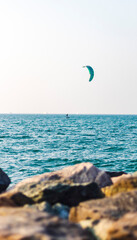 Person kite surfing in open sea. Sports