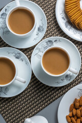 Tea time with Biscuits and dry fruits, White Plan Cashew, and Almonds.
seave in the white marble Tea set. 