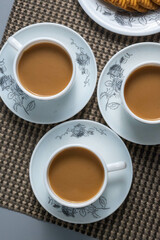 Tea time with Biscuits and dry fruits, White Plan Cashew, and Almonds.
seave in the white marble Tea set. 