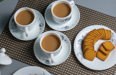 Tea time with Biscuits and dry fruits, White Plan Cashew, and Almonds.
seave in the white marble Tea set. 