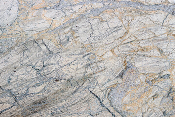Marble stone texture with varied pattern with fine lines.