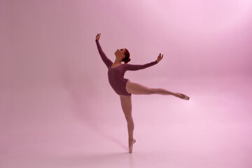 Fototapeta na wymiar Beautiful girl dancing ballet dance in studio