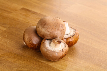 Raw brown champignons mushroom heap