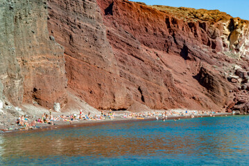 Tourists on the shores of the Red Beach in Santorini