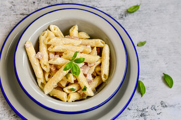  Fresh home made italian  penne  pasta   alla carbonara with  cream sauce  ,  bacon,egg, parmesan cheese ,olive oil and black pepper) 