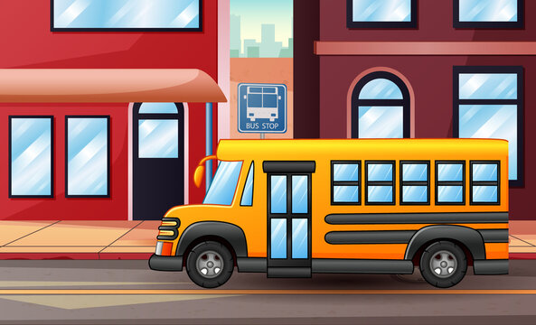 Yellow school bus passing through city street