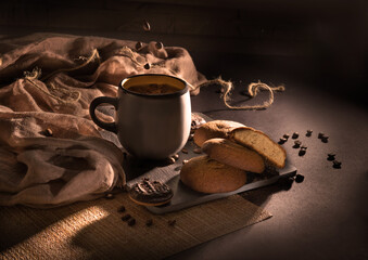 cup of coffee with beans and cookies