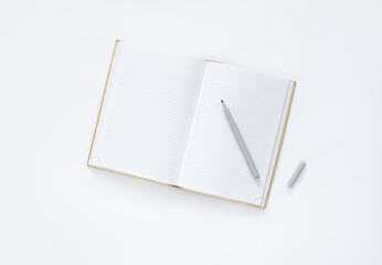 notebook and pen on a white background, top view. 