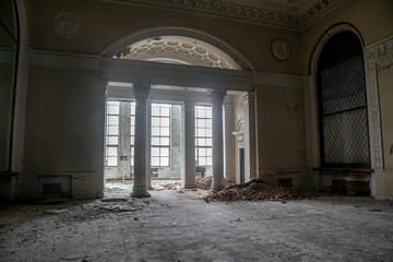 Beautiful interior of an old abandoned palace. Hall with high ceilings. Colorful walls and ceiling....