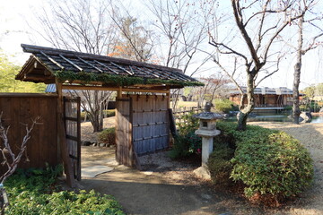 The bamboo lattice door at the entrance to the Japanese garden at Maebashi-koen Park in Maebashi City in Gunma Pref. in Japan　日本の群馬県前橋市にある前橋公園の日本公演入り口の竹製格子戸