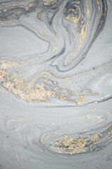 Natural luxury. Tiffany blue. Abstract ocean- ART. Style incorporates the swirls of marble or the ripples of agate. Very beautiful blue paint with the addition of gold powder.	
