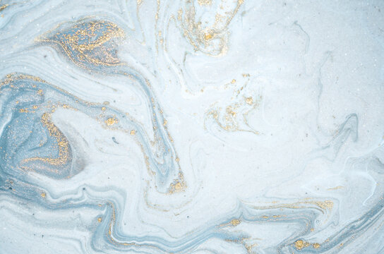Natural luxury. Tiffany blue. Abstract ocean- ART. Style incorporates the swirls of marble or the ripples of agate. Very beautiful blue paint with the addition of gold powder.	
