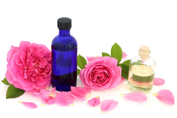 Rose water in a bottle, pink flowers, petals, almond oil. Used for skin hydration, helps to maintain the skins ph balance, is anti bacterial, can help heal acne, dermatitis and eczema. 