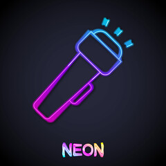 Glowing neon line Flashlight icon isolated on black background. Vector