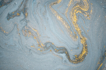 Natural luxury. Tiffany blue. Abstract ocean- ART. Style incorporates the swirls of marble or the ripples of agate. Very beautiful blue paint with the addition of gold powder.	
