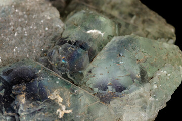 macro mineral fluorite stone on black background