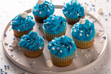 Unique cupcakes made of blue cream for fat thursday.