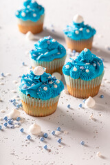 Tasty cupcakes made of blue cream for fat thursday.