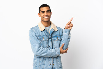 African American man over isolated white background happy and pointing up