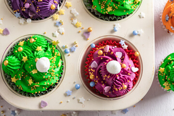 Beautiful multicolored cupcakes made of cream for fat thursday.