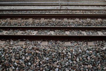 detail of train rails at sunset