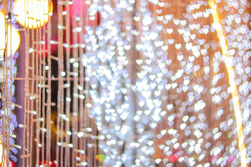 Blurred bokeh background created by the Christmas lights to celebrate the New Year. Beautiful Christmas lights backgrounds and backdrop can be used for any design Or a Christmas greeting card.
