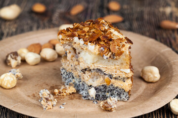 sweet cake with buttercream and sponge cake and lots of poppy seeds and nuts