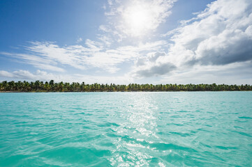open blue sea cumulus clouds