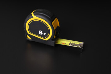 Flexometer or tape measure on black background and with space to write