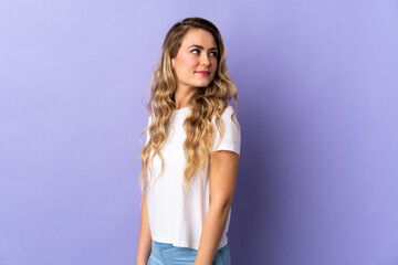 Fototapeta premium Young Brazilian woman isolated on purple background . Portrait