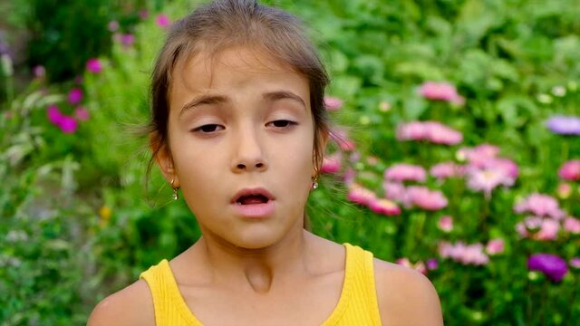 The child is allergic to flowers. Selective focus.