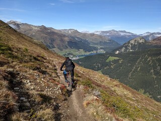 Fototapeta na wymiar Enduro Rider downhill at Davos, Swiss Mountains Alps at Davos, Switzerlnad
