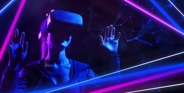 Metaverse virtual event future game entertainment digital technology . Teenager having fun play VR virtual reality glasses sport game metaverse NFT game 3D cyber space futuristic neon background.