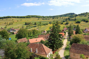 Fototapeta na wymiar The village of Biertan, (Birthälm) and surrounding landscape, Sibiu County, Romania. Seen from the fortified church of Biertan, which is a UNESCO World Heritage Site.