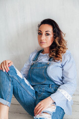 portrait of a beautiful woman in a denim suit